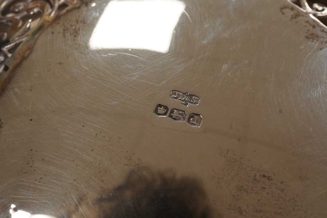 A George V pierced silver bowl, with gadrooned border, on three paw feet, James Dixon & Sons, Sheffield, 1931, diameter 20.8cm, 15oz.